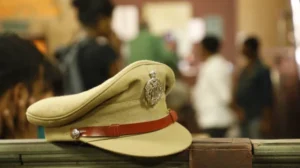 depositphotos_592943952-stock-photo-indian-police-hat-table
